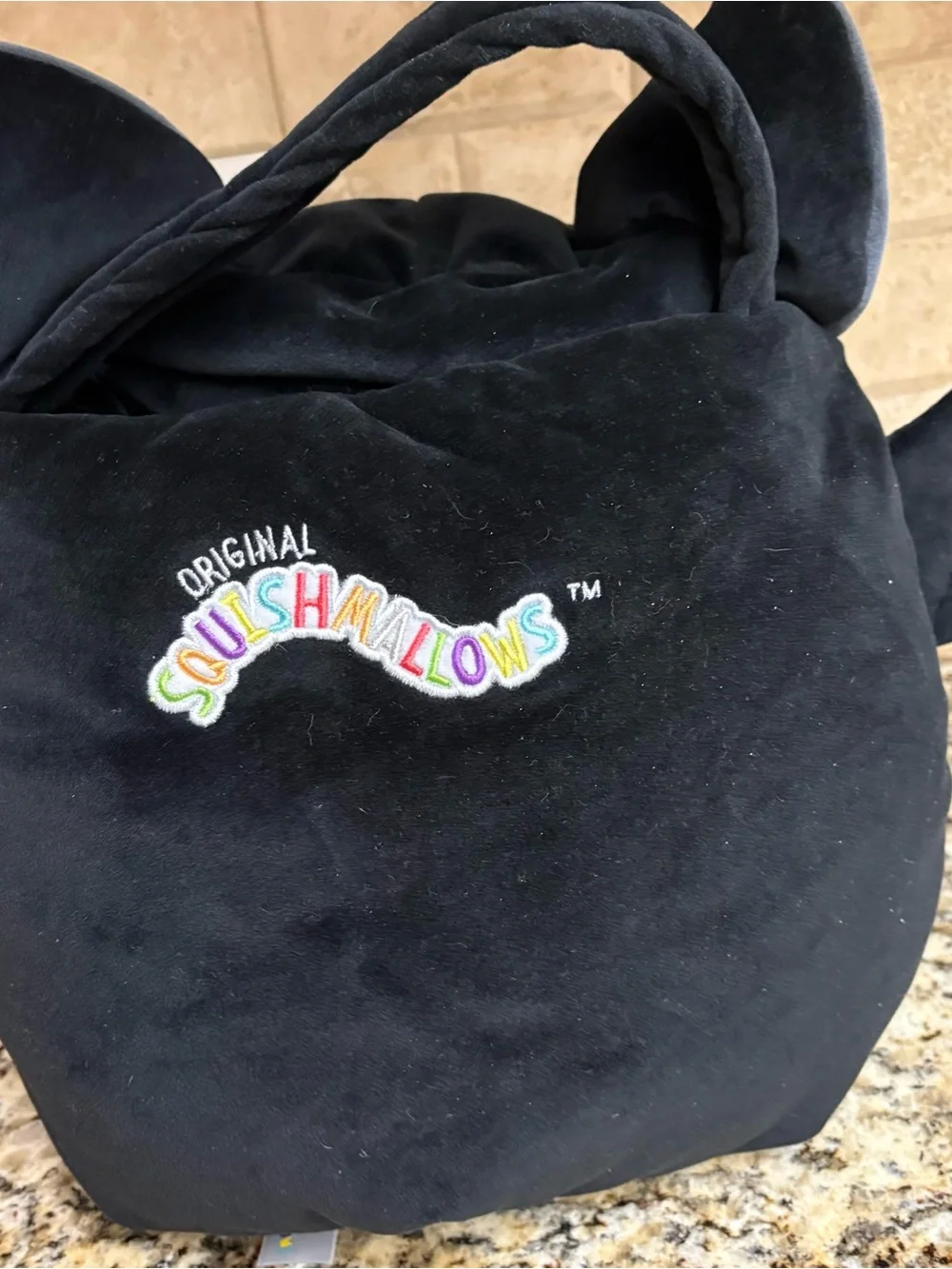 Squishmallows Black Plush Monster Backpack with Gray Belly and Red Smile